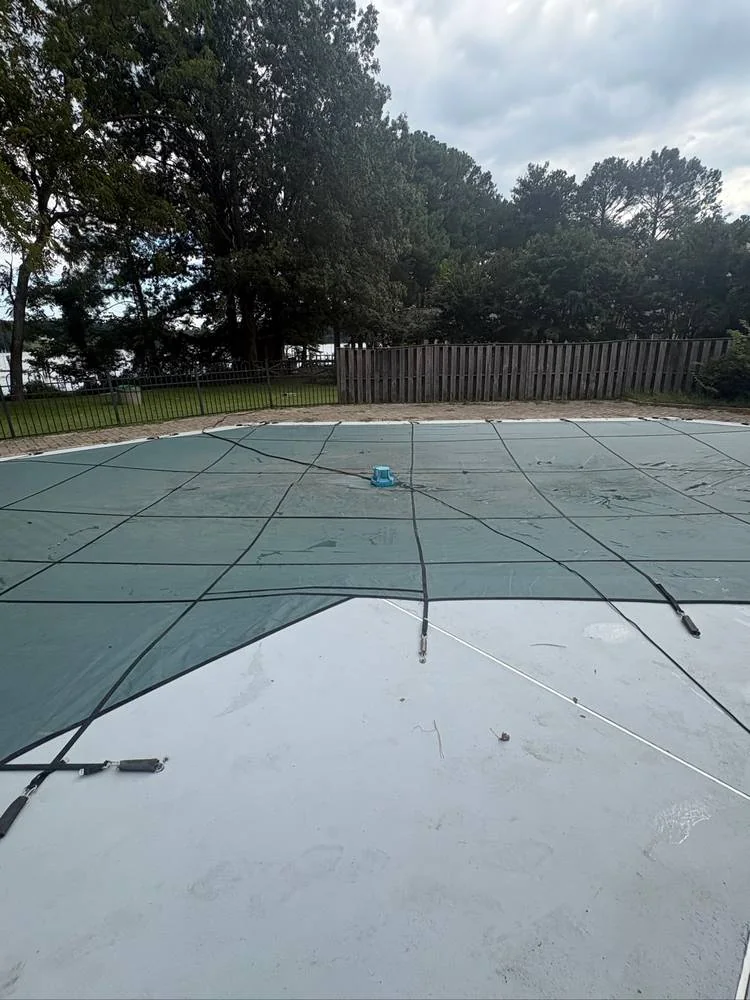 Green cover on a pool following a Pool Store closing visit